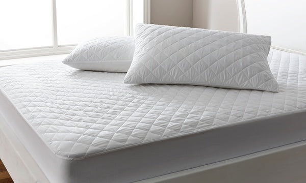 Bedroom with all white Pillows and Mattress