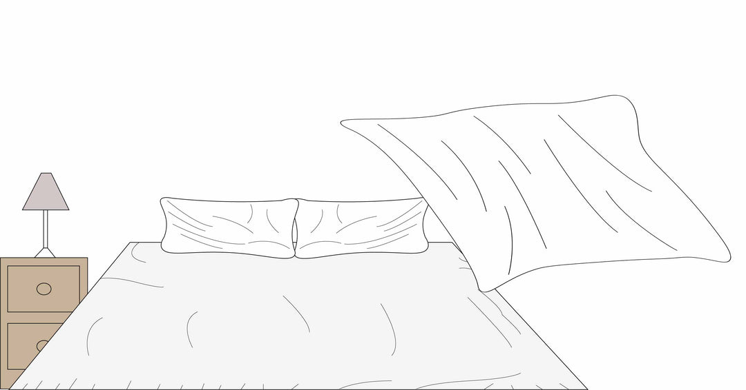 Bedsheets being put on the bed